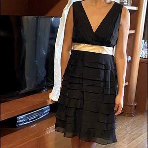 Black ruffle dress BCBG with beige/ cream ribbon V neck